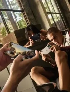 People playing games on the OnePlus 15 5G, showcasing its 165Hz display, fast chipset, and high touch response rate.