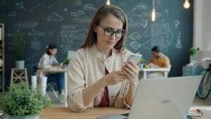 Woman browsing on a smartphone, illustrating smooth everyday performance on Micromax phones such as IN 2b and IN Note 2.